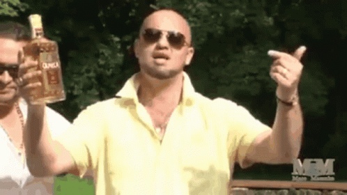 Man In Yellow Shirt Holding Duca Tequila GIF