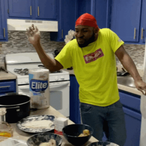 Man in Yellow Shirt in Kitchen