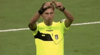 Man in Yellow Shirt Making Peace Sign