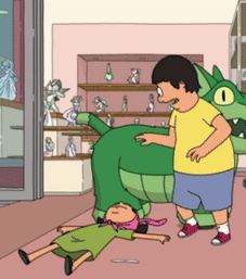 Man in Yellow Shirt Next to Green Dinosaur