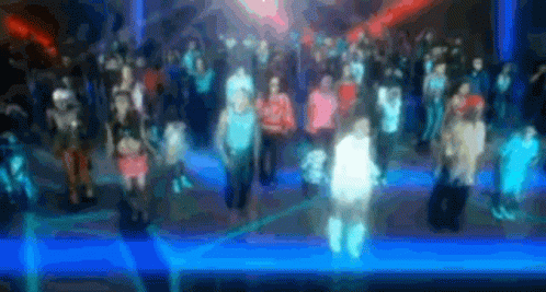 Man In Yellow Shirt Next To Man In Red Hat And Woman In Blue Shirt GIF