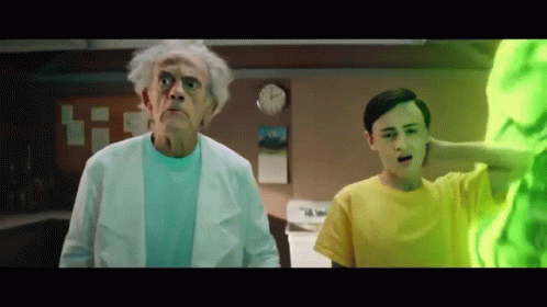 Man in Yellow Shirt Next to Older Man in White Coat