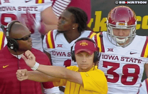 Man in Yellow Shirt Number 38 With Iowa State Football Players