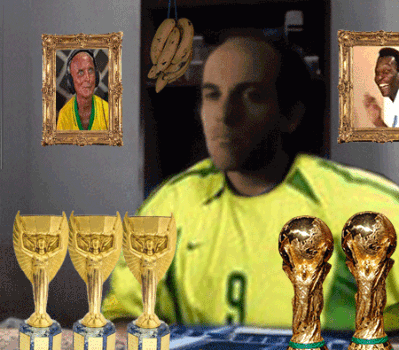 Man In Yellow Shirt Number 9 Surrounded By Trophies GIF