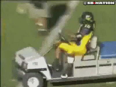 Man in Yellow Shirt on Golf Cart With SB Nation Logo