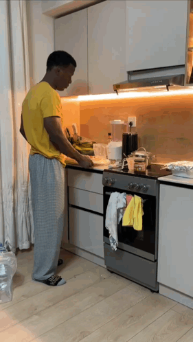 Man in Yellow Shirt Preparing Food