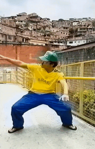 Man in Yellow Shirt Saying Brasil