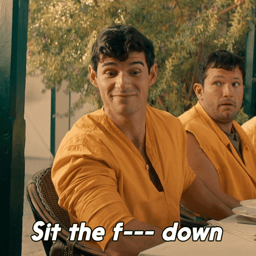 Man in Yellow Shirt Saying Sit Down