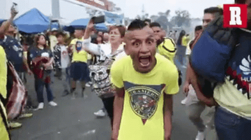 Man in Yellow Shirt Screaming