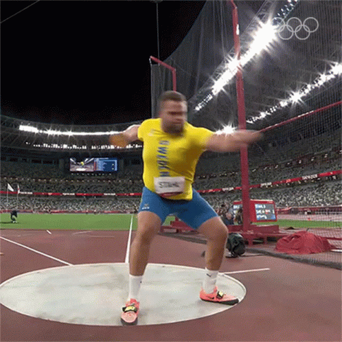 Man in Yellow Shirt Throwing Discus Olympics