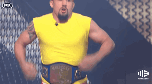 Man In Yellow Shirt With Hartford Belt GIF