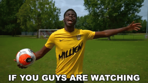 Man In Yellow Shirt With Million Holding Soccer GIF