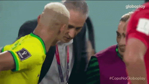 Man in Yellow Shirt with Number 8 Talking