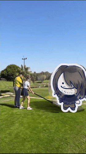 Man In Yellow Shirt With Woman On Golf Course GIF