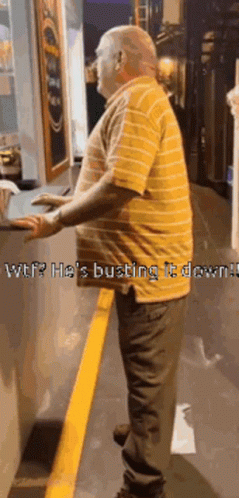Man In Yellow Striped Shirt Standing Next To Yellow Line GIF