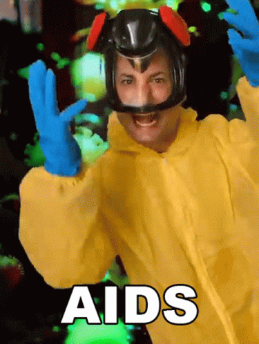 Man In Yellow Suit And Blue Gloves Saying Aids GIF
