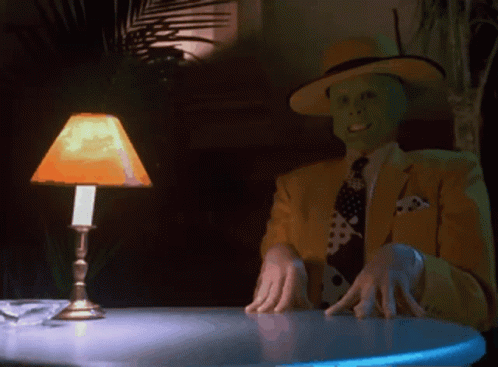 Man in Yellow Suit Sitting at Table