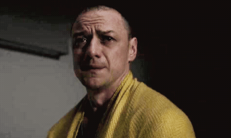 Man in Yellow Sweater and Scarf Making Funny Face