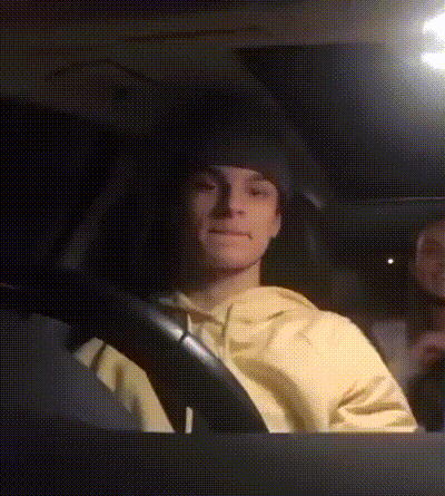Man In Yellow Sweatshirt Driving Car GIF