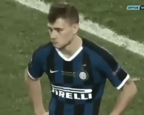 Man in Yellow Sweatshirt With Letter C Next to Woman in Blue Shirt