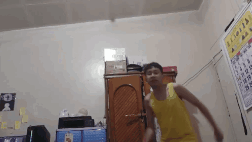 Man in Yellow Tank Top Dancing