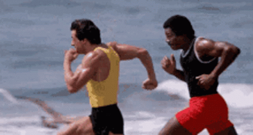 Man in Yellow Tank Top Running Beach