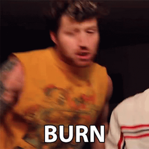Man in Yellow Tank Top Says Burn