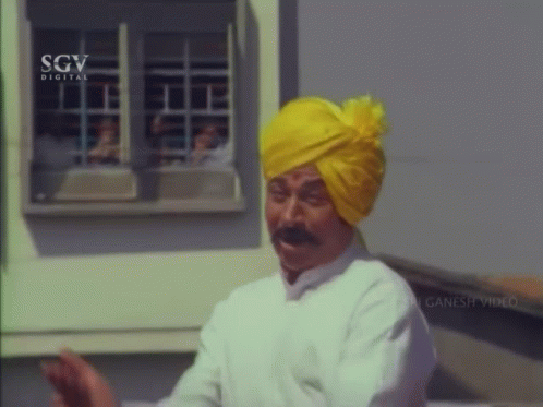 Man in Yellow Turban and White Shirt