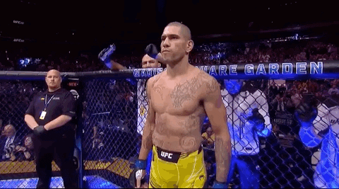 Man In Yellow UFC Shorts In Boxing Cage GIF