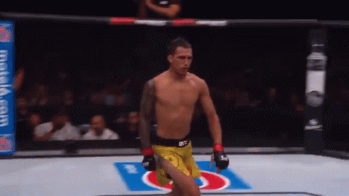 Man in Yellow UFC Shorts Walking Out