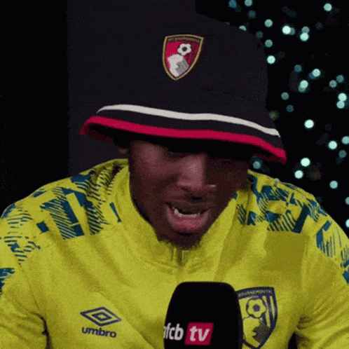 Man in Yellow Umbro Jacket Talking