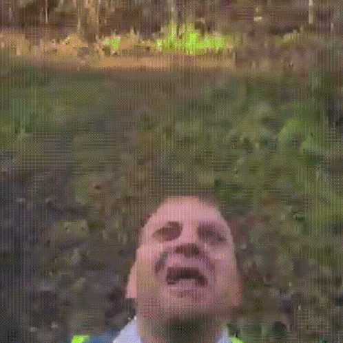 Man in Yellow Vest and Tie Screaming