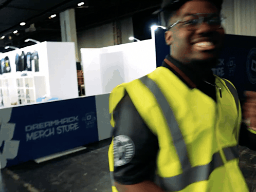 Man in Yellow Vest Smiling at Dreamhack