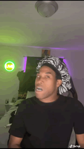 Man in Zebra Hat Making Funny Face