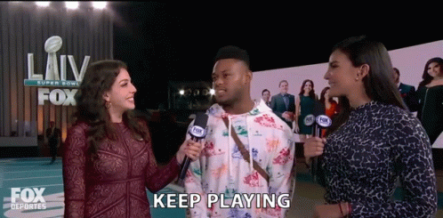 Man Interviewed By Two Women Saying Keep Playing GIF