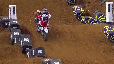 Man Jumping Dirt Bike Over Monster Energy Banner
