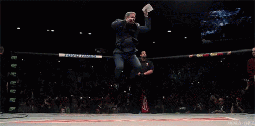 Man Jumping Holding Paper Saying UFC GIF