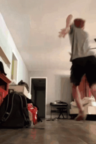 Man Jumping in Living Room