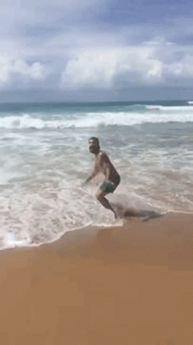 Man Jumping in Ocean