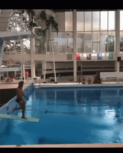 Man Jumping Into Pool with L Eau Sign