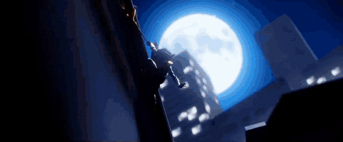 Man Jumping Off Building in Front of Full Moon