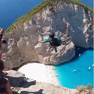 Man Jumping Off Cliff Zakynthos Island In Greece GIF