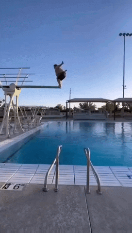 Man Jumping Off Diving Board