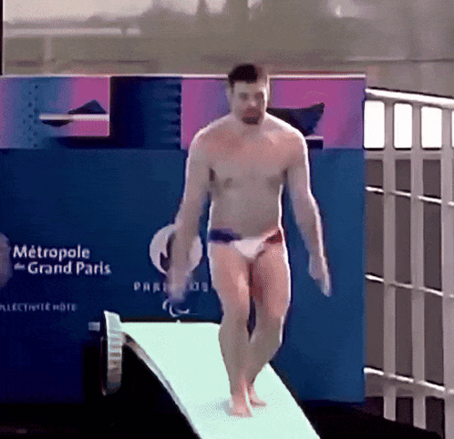 Man Jumping Off Diving Board