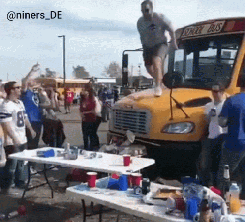 Man Jumping Off School Bus Hood