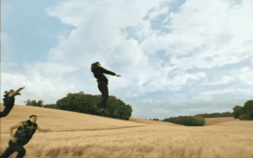 Man Jumping While Another Man Watches
