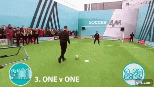 Man Kicking Soccer Ball at Soccer AM Building