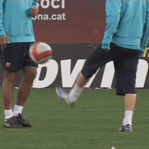 Man Kicking Soccer Ball in Front of Dva Sign