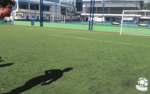 Man Kicking Soccer Ball