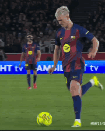 Man Kicking Soccer Ball With Spotify Logo GIF